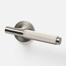 Lo & Co Linear Knurled Lever door handle in brushed nickel finish on a modern door.
