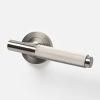 Lo & Co Linear Knurled Lever door handle in brushed nickel finish on a modern door.