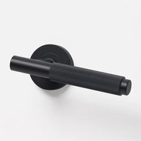Lo & Co Linear Knurled Lever door handle in brushed metal finish, showing textured grip and sleek modern design.