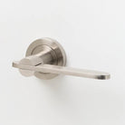 Brass Lo & Co Intersect lever handle with sleek, modern design for interior doors.