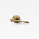Lo & Co Interiors Intersect Lever door handle in brushed bronze finish, showing sleek design and modern hardware details.