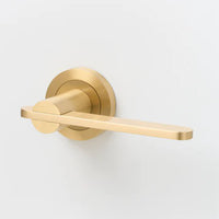 Lo & Co Intersect Lever door handle in brushed nickel finish, mounted on a modern door with visible hardware and clean design.