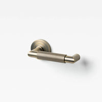 Lo & Co Kintore knurled return lever for door hardware, shown in close-up with textured metal finish.