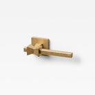 Lo & Co Forma Lever door handle in brushed bronze finish, mounted on a door with visible hardware and modern design style.