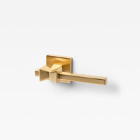 Lo & Co Forma Lever door handle in polished metal finish, mounted on a door showing its sleek modern design.
