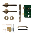Momo Belgravia plain lever handle in dark bronze finish for door entry, shown on a door in a modern interior setting