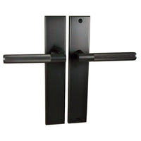 Nidus Domici knurled lever passage set with long backplate, featuring a stylish brass finish and textured handle for interior doors.