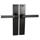 Nidus Domici knurled lever passage set with long backplate in matte gold finish, showing detailed textured handle and sleek design.