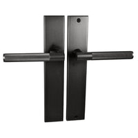 Nidus Domici knurled lever passage set with long backplate in matte gold finish, showing detailed textured handle and sleek design.