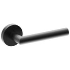 Black CETINA door handle by Style Finish Doorware mounted on a door, showcasing modern, sleek hardware design.