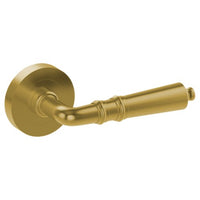 Latina door handle by Style Finish Doorware, satin brass finish, sleek modern design on a door.