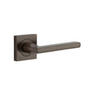 Pair of Iver Baltimore lever door handles on square rose, featuring a sleek, modern design in polished finish.