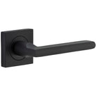 Pair of Iver Baltimore Lever door handles on square rose, featuring sleek metal design and modern hardware style.
