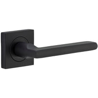 Pair of Iver Baltimore Lever door handles on square rose, featuring sleek metal design and modern hardware style.