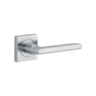 Pair of Iver Baltimore lever handles on square rose, featuring a sleek, modern design for door hardware.