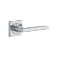 Pair of Iver Baltimore lever handles on square rose, featuring a sleek, modern design for door hardware.