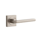 Pair of Iver Baltimore lever handles on square rose, featuring a sleek, modern design for interior door hardware.