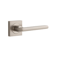 Pair of Iver Baltimore lever handles on square rose, featuring a sleek, modern design for interior door hardware.