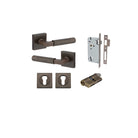 Pair of Iver Brunswick lever door handles on square rose, featuring a sleek, modern design in polished finish.