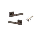 Pair of Iver Brunswick lever door handles on square rose, with a sleek brass finish and modern design for interior doors.