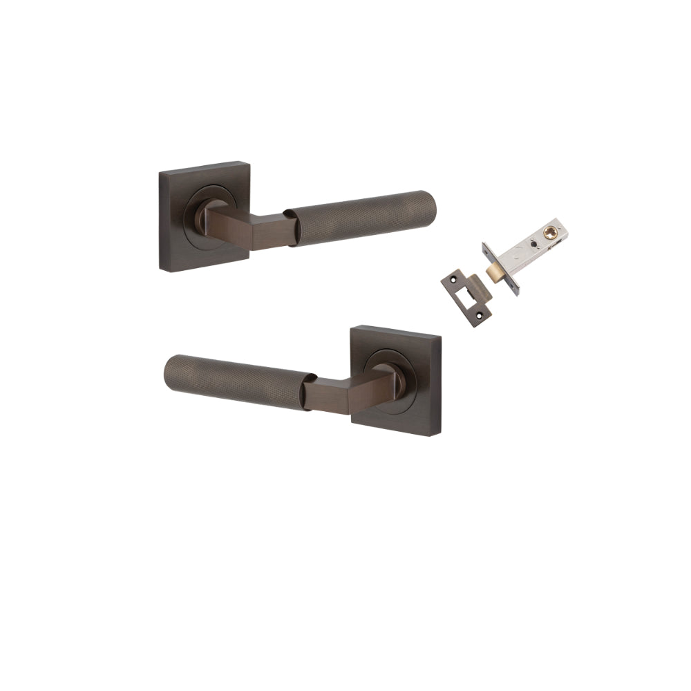 Pair of Iver Brunswick lever door handles on square rose, featuring a sleek, modern design in a durable finish.