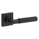 Pair of Iver Brunswick lever door handles on square rose, featuring a sleek, modern design for interior doors.