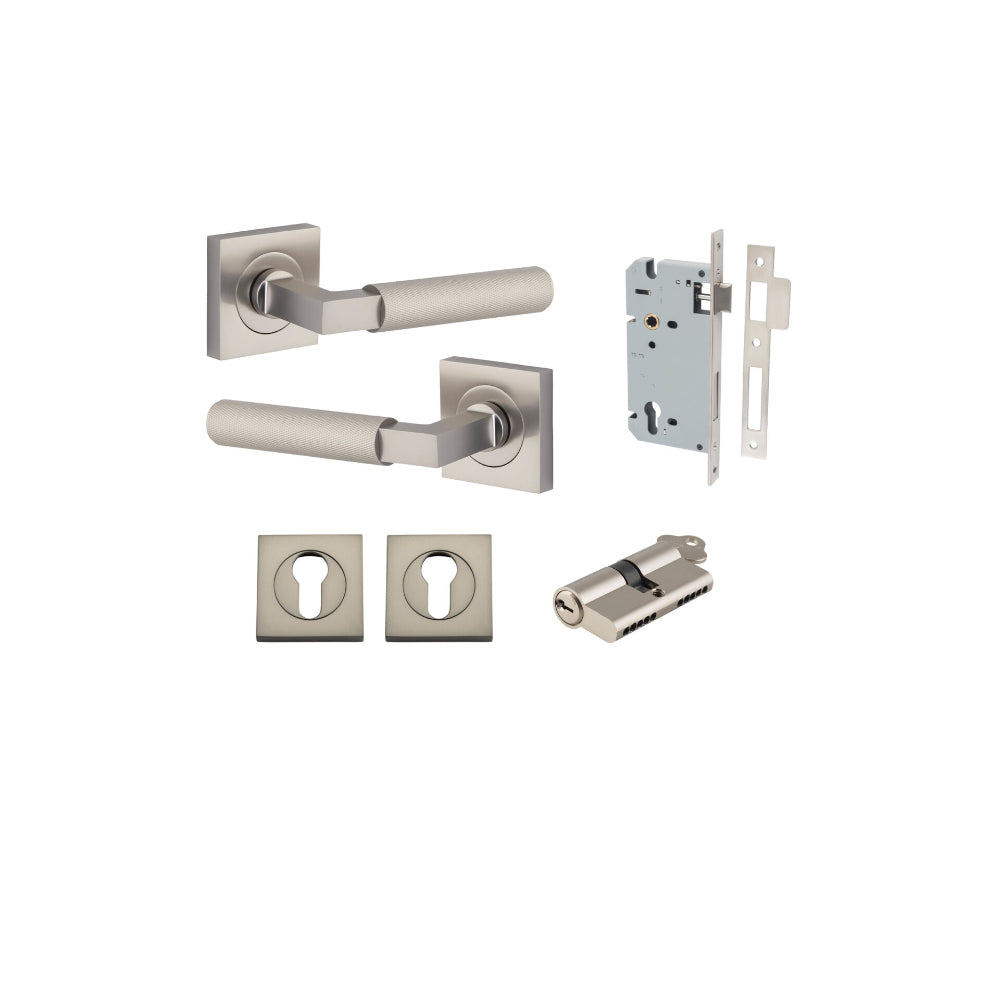 Pair of Iver Brunswick lever door handles on square rose, featuring polished brass finish and classic design.