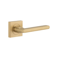 Pair of Iver Baltimore Lever handles on square rose, featuring a sleek, modern design for door hardware.