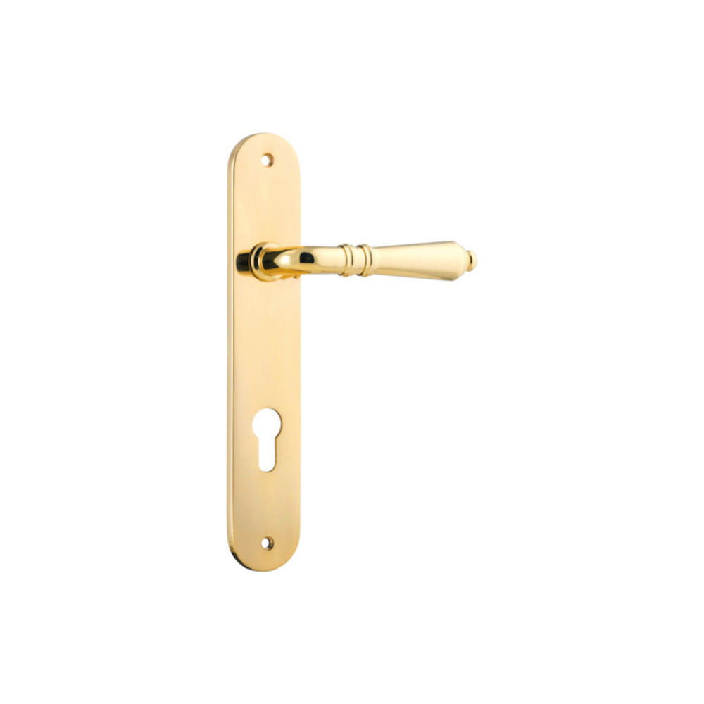 Pair of Iver Sarlat lever handles with oval backplates, showcasing contemporary bronze finish and elegant design.