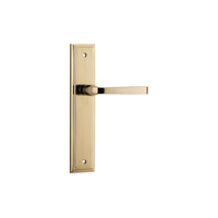 Pair of Iver Annecy lever handles on stepped backplates, showcasing elegant brass hardware for doors.
