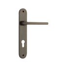 Pair of Iver Baltimore lever door handles on oval backplates, featuring a sleek, modern design in a polished finish.