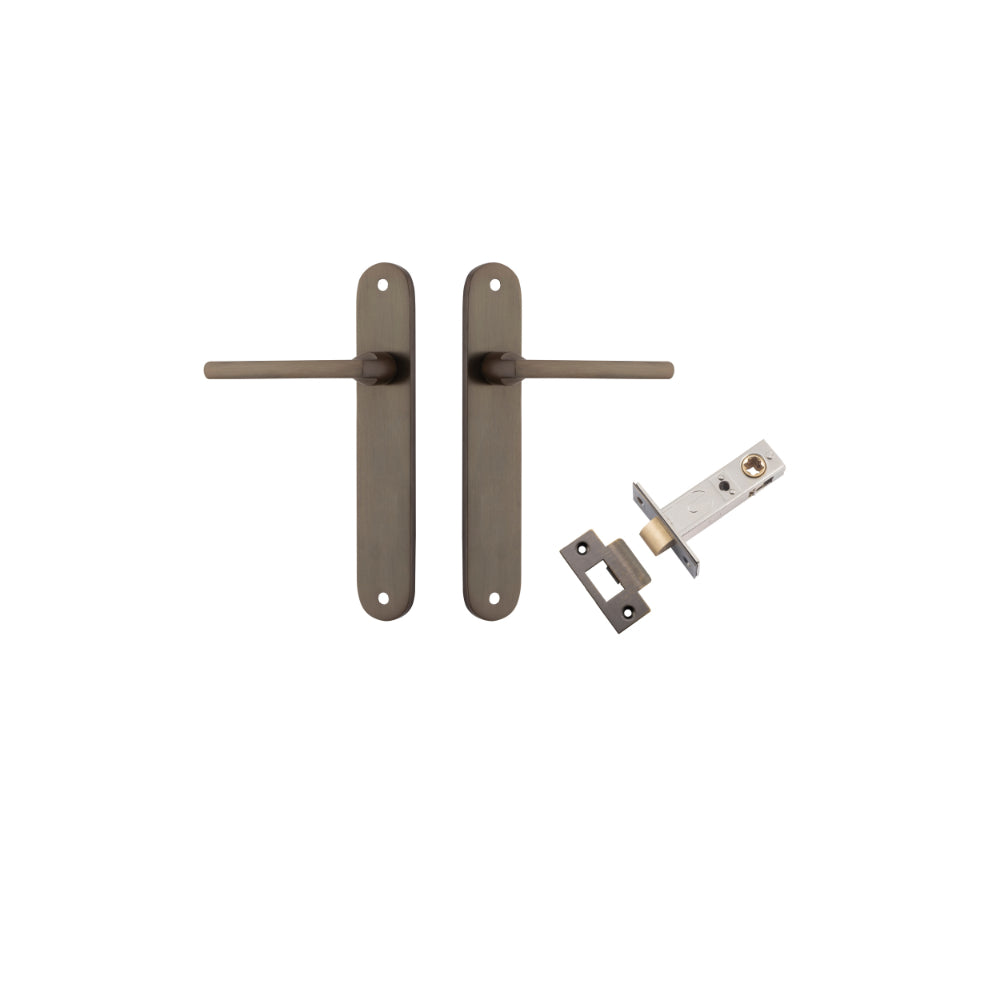 Pair of Iver Baltimore lever door handles on oval backplates, featuring a sleek, modern design in a polished finish.