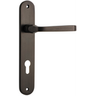 Pair of Iver Annecy lever handles on oval backplates, featuring a sleek modern design for interior door use.