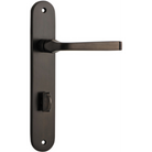 Pair of Iver Annecy lever handles on oval backplates, featuring elegant brass finish and traditional design for bathroom or kitchen use.