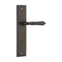 Pair of Iver Sarlat lever handles on stepped backplates, showcasing elegant brass finish and classic European design.