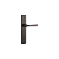 Pair of Iver Annecy lever door handles on stepped backplates, featuring polished metal finish and modern design.