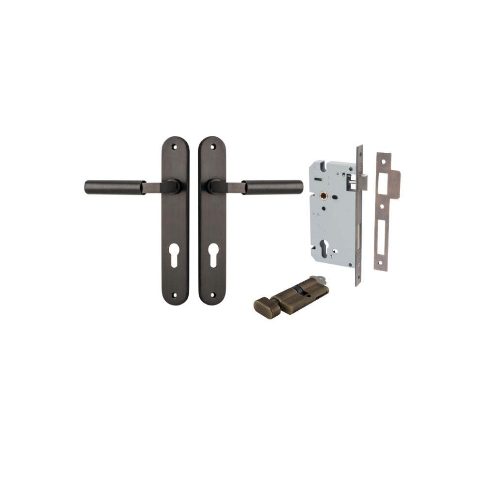 Pair of Iver Berlin lever door handles with oval backplates, featuring a sleek, modern design in a polished finish.