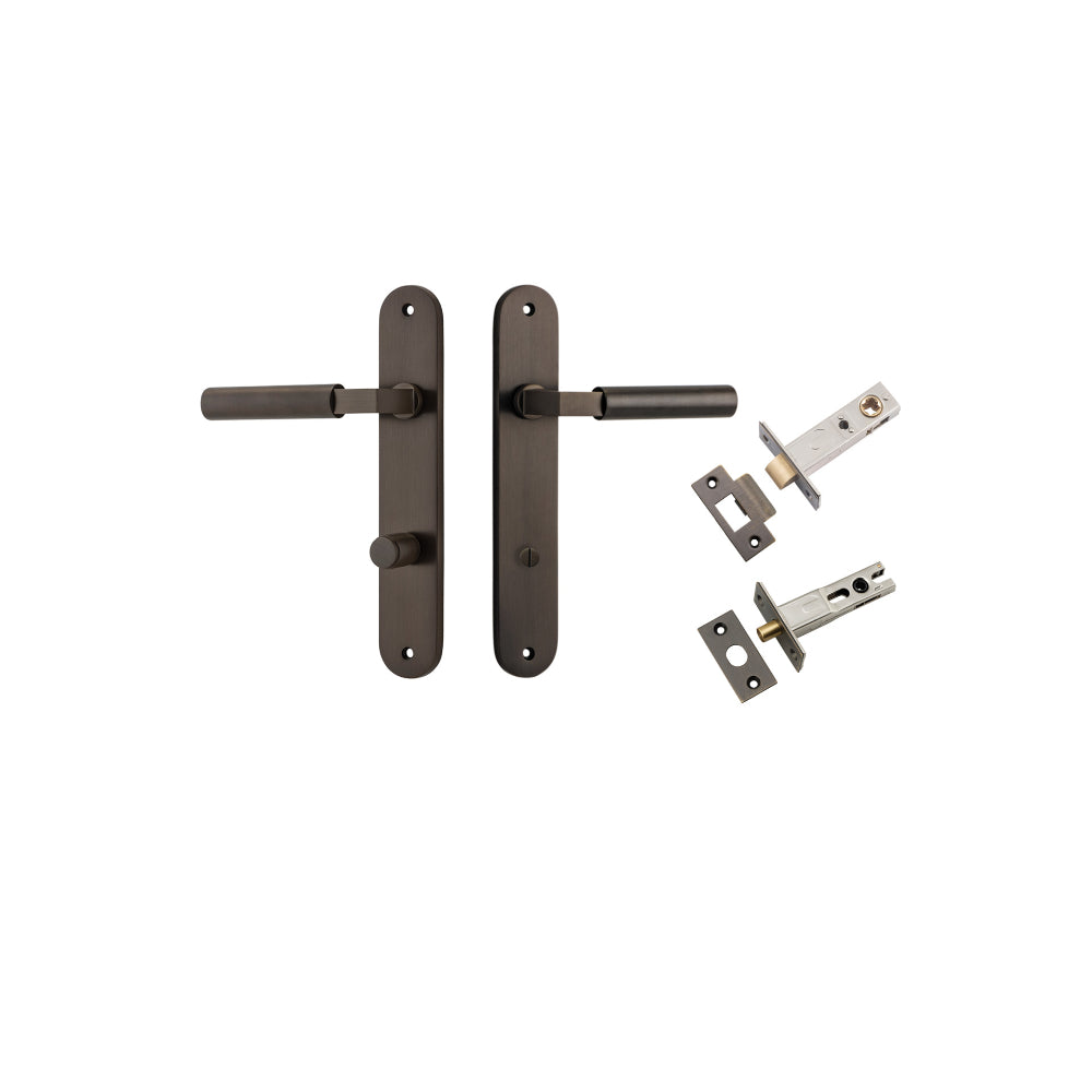 Pair of Iver Berlin lever door handles on oval backplates with a sleek, modern design, shown in a close-up image.