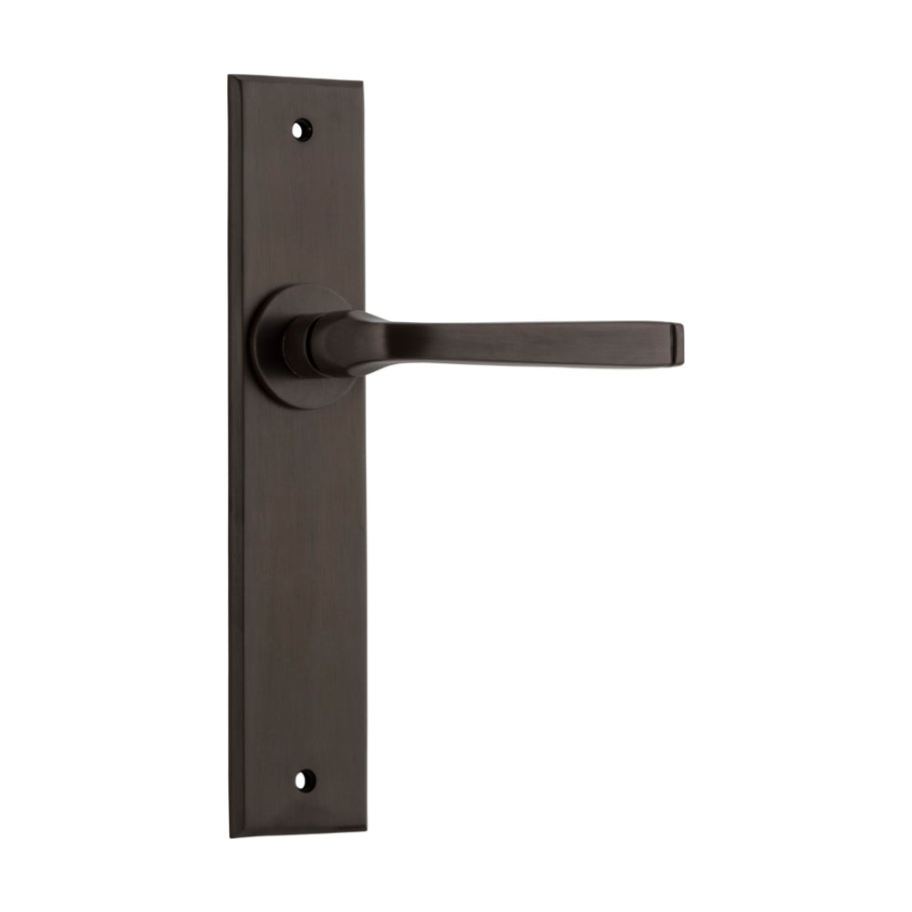 Pair of Iver Annecy lever door handles with chamfered backplates, featuring a sleek, modern design for stylish interior doors.