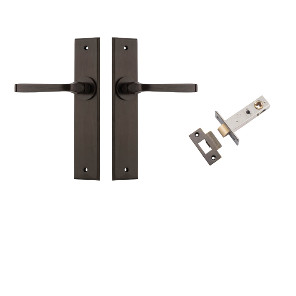 Pair of Iver Annecy lever door handles with chamfered backplates, featuring a sleek, modern design in a natural finish.