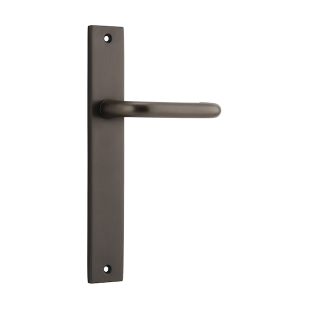 Pair of Iver Oslo lever handles on rectangular backplates, architectural hardware for doors, in polished metal finish.