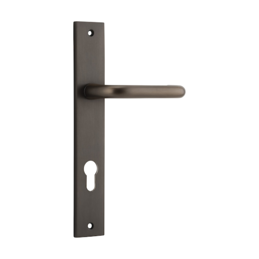 Pair of Iver Oslo Lever handles on rectangular backplates for architectural hardware, featuring sleek metallic finish.