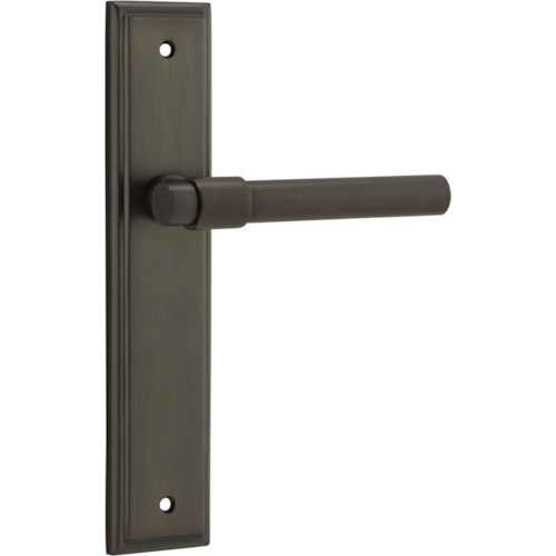 Pair of Iver Helsinki lever door handles on stepped backplates, featuring sleek modern design in polished finish.