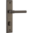 Pair of Iver Helsinki lever door handles on stepped backplates, showcasing sleek modern design and brushed metal finish.