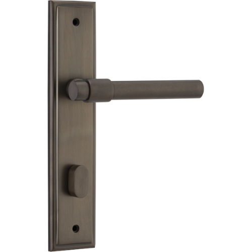 Pair of Iver Helsinki lever door handles on stepped backplates, showcasing sleek modern design and brushed metal finish.