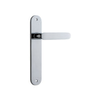 Pair of Iver Bronte lever door handles on oval backplates, featuring a polished brass finish and classic design.
