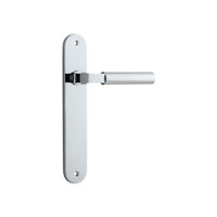 Pair of Iver Berlin lever door handles on oval backplates, polished metal finish, suitable for modern interior doors.