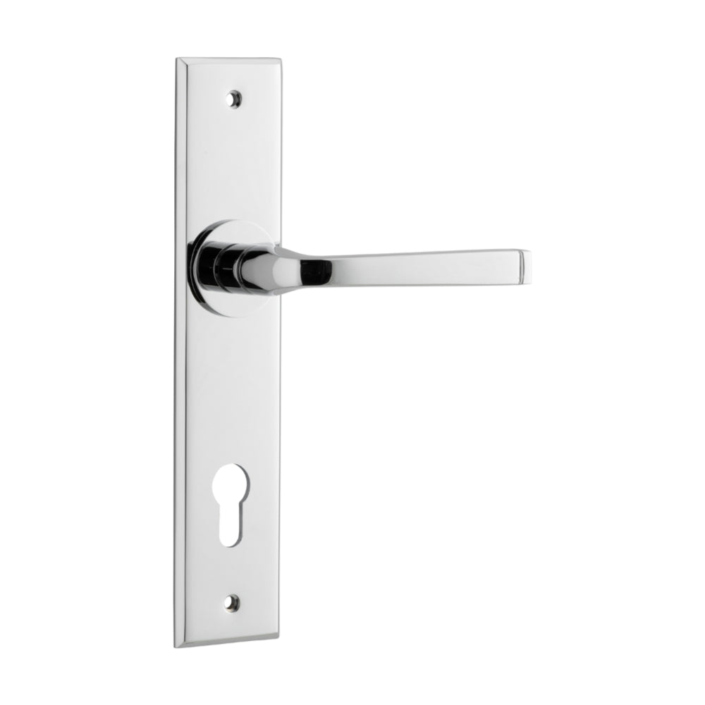 Pair of Iver Annecy lever handles on chamfered backplates, showcasing elegant brass finish and modern design.