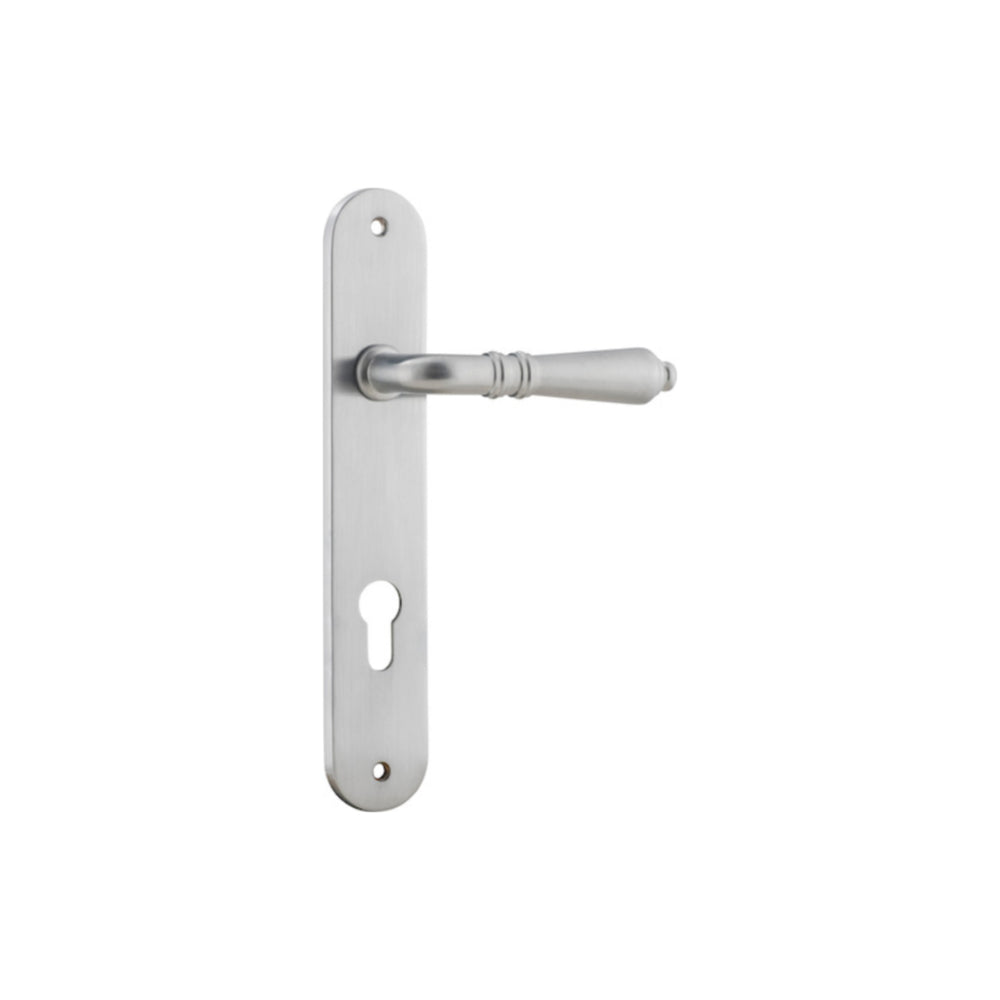Pair of Iver Sarlat lever handles on oval backplates, featuring elegant brass finish and traditional design for doors.