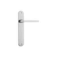 Pair of Iver Baltimore lever handles on oval backplates, featuring a sleek, modern design for interior doors.